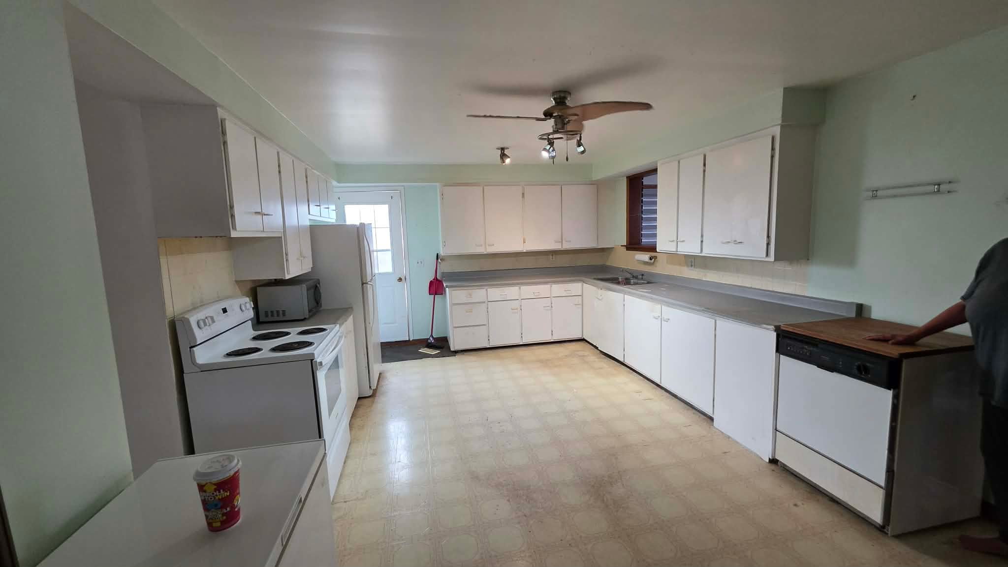 Outdated White Kitchen with Laminate Countertops - Before